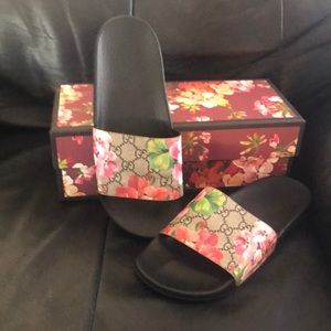Women’s Gucci slides.